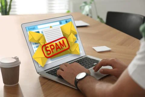 Spam warning message, envelope illustrations popping out of device display... Stock Photos