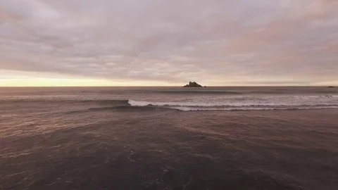 Span along the ocean waves. Reflection of sun and clouds in the water. Beautiful Stock Footage 72766910