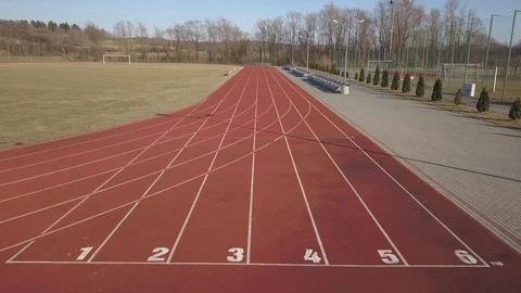 Span along the red running track in the stadium. Stock Footage 104341879