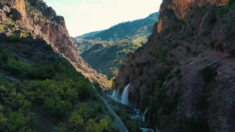 Span between mountain cliffs, view of beautiful waterfalls Stock Footage 316250891
