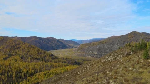 Span of the camera from left to right. mountainous terrain. autumn mountain Video stock 145609957