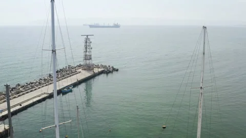 Span of the camera through the masts. Aerial view support and repair of yachts Stock Footage 236928188