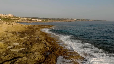  Span on a drone along a rocky shore.  Beach and sea. 4K Stock Footage 104656255