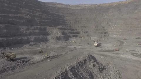 The span of the drone in a career at the bottom. Iron ore mining. Excavators and Stock Footage 101782628