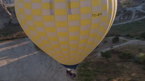 The span of a large yellow balloon, in a basket of people, close-up. Cappadocia. Stock Footage 105507037