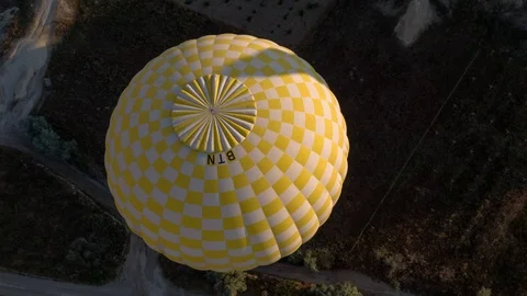 The span of a large yellow balloon, in a basket of people, close-up. Cappadocia Stock Footage 105508549