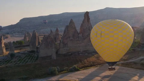The span of a large yellow balloon, in a basket of people, close-up. Cappadocia Stock Footage 105508636