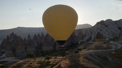 The span of a large yellow balloon, in a basket of people, close-up. Cappadocia Stock Footage 105516684