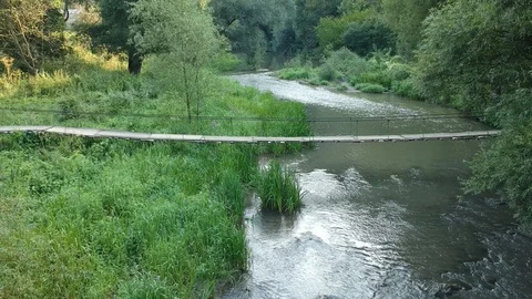 Span over a wooden bridge Stock Footage 114082337