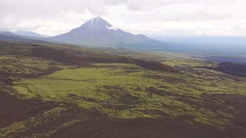 The span of the volcano. Flying along the river to the mountains Stock Footage 72683087