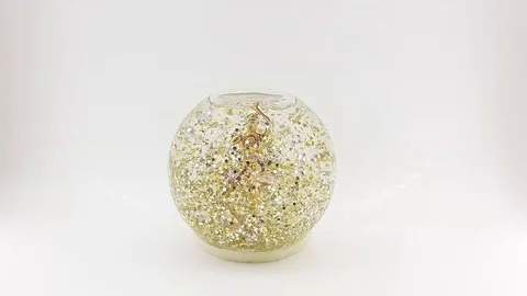 Spangles rotate in a glass ball Stock Footage 124828734