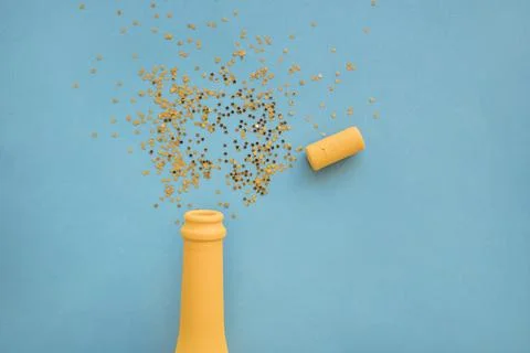 Spangles scattered from bottle table 스톡 사진