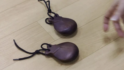 Spanish castanets in the hands Stock Footage 91716288