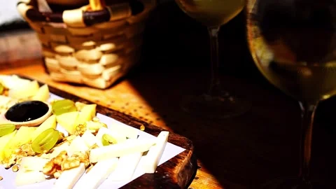 Spanish cheese platter served in a tapas bar with Galician white wine Albariño Stock Footage 277607096