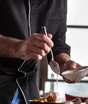 Spanish chef is making the final touch to tapas Stock Photos