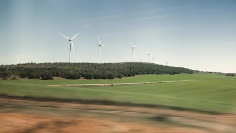 Spanish countryside windmills from inside train Stock Footage 255864798