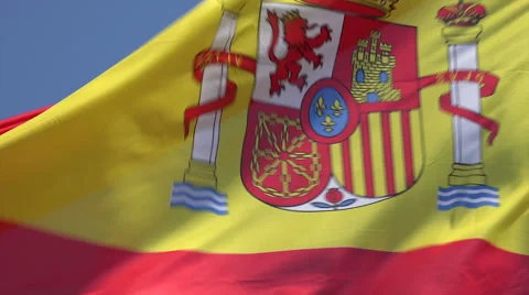 Spanish flag blowing in wind with blue sky background, Spain Stock Footage 49952374