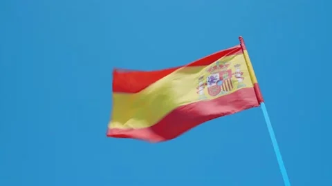 Spanish Flag Blowing In The Wind With Blue Sky Stock Footage 158299840