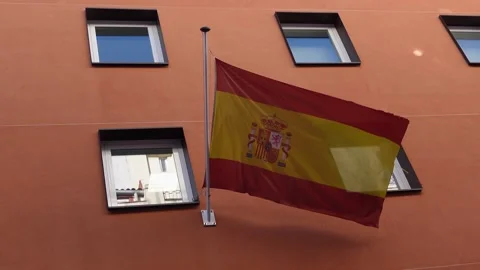 Spanish flag flying on a building Stock Footage 294821969