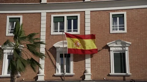 Spanish flag flying on Comandancia Naval de Malaga building Stock Footage 240011182