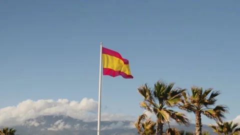 Spanish flag, medium shot with sky as background. Slow motion Stock Footage 137301002