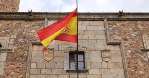 Spanish flag moving with the wind in the old city of Caceres. Stock Footage 222986710