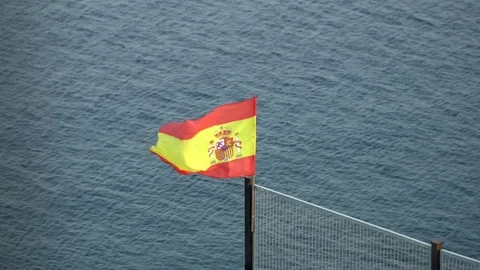 Spanish flag with sea at the background Stock Footage 80061030