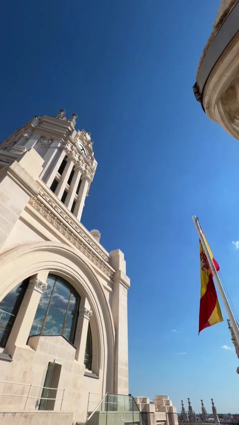 Spanish flag waving on top of Palacio de Cibeles in Madrid Stock Footage 341373987