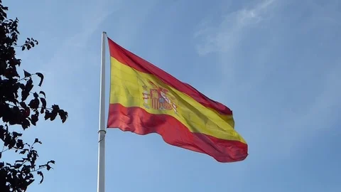 Spanish flag waving in the wind on a pole in Madrid Stock Footage 120541565
