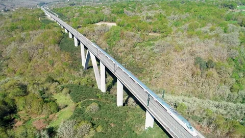 Spanish high speed train running over a viaduct, aerial footage from a drone Stock-Footage 298847322