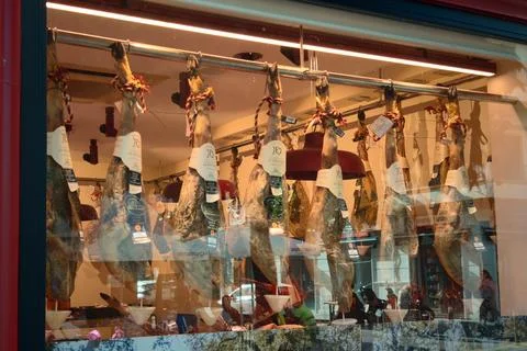 Spanish iberian ham display inside gourmet shop in Seville, Spain Stock Photos