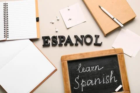 Spanish language learning with "espanol" letters, chalkboard, notebooks, and  Stock Photos