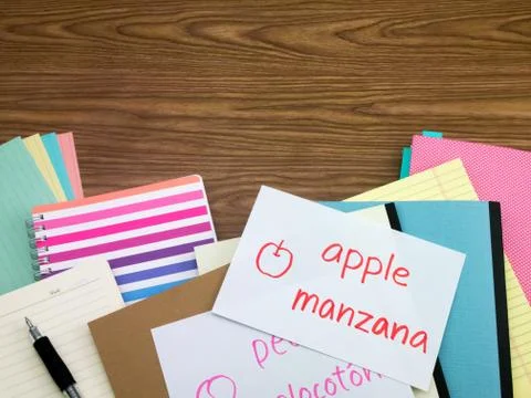 Spanish; Learning New Language Writing Words on the Notebook Stock Photos