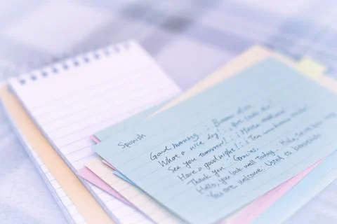 Spanish; Learning New Language Writing Greetings on the Notebook Stock Photos