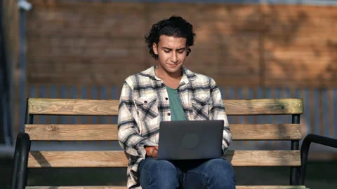 Spanish modern guy freelancer programmer business developer working laptop at Stock-Footage 220679964