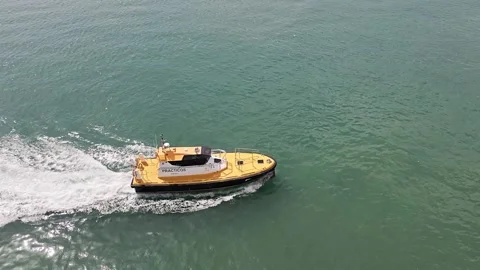 Spanish pilot boat speeding through harbor water Stock Footage 339946655