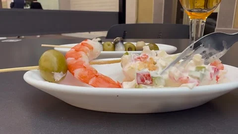 Spanish Tapas: Closeup View of the Hand of a Caucasian Eating Homemade Pincho Stock Footage 337713887
