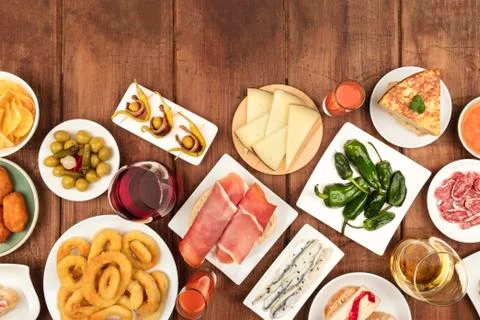 Spanish tapas food on dark background with wine and copy space Fotos Stock