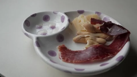 Spanish Tapas Platter with Jamon, Cheese, Olives, and Colines on Decorative Stock Footage 302576962