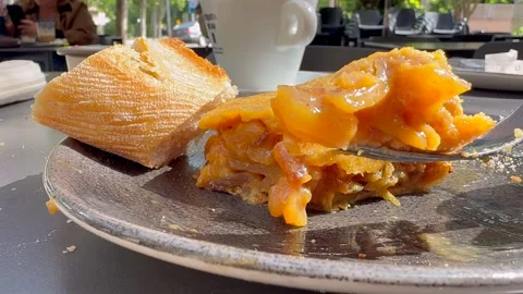 Spanish Tapas: Recent Made Tortilla de Patatas (Spanish Omelette) on a Plate Stock Footage 335930677