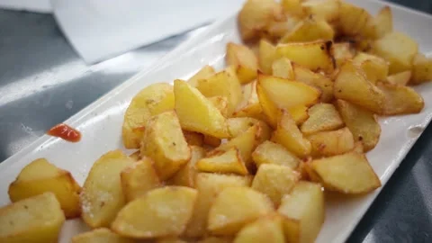 Spanish tapas seafood fish potatoes tortilla hands children family eating Stock Footage 235608462