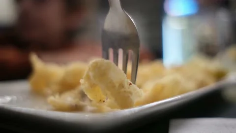 Spanish tapas seafood fish potatoes tortilla hands children family eating Stock Footage 235608559
