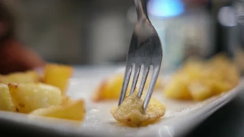Spanish tapas seafood fish potatoes tortilla hands children family eating Stock Footage 235608630