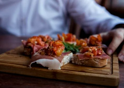 Spanish Tapas Served in Restaurant on Rustic Wooden Board Stock Photos