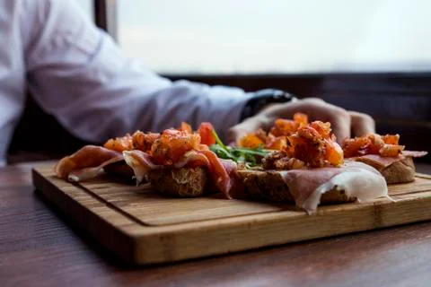 Spanish Tapas Served in Restaurant on Rustic Wooden Board Stock Photos