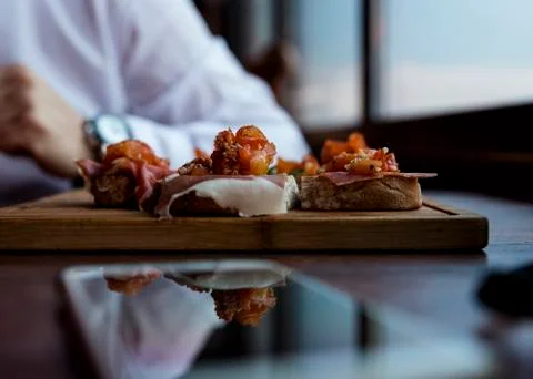 Spanish Tapas Served in Restaurant on Rustic Wooden Board Stock Photos