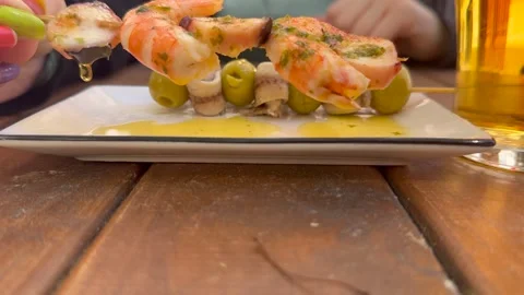 Spanish Traditional Tapas: Closeup View of the Hand of a Caucasian Woman Stock Footage 334836715
