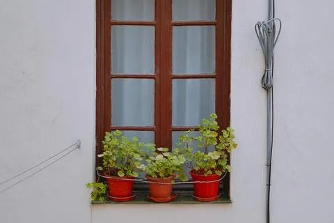 Spanish window on the facade of the house Photos