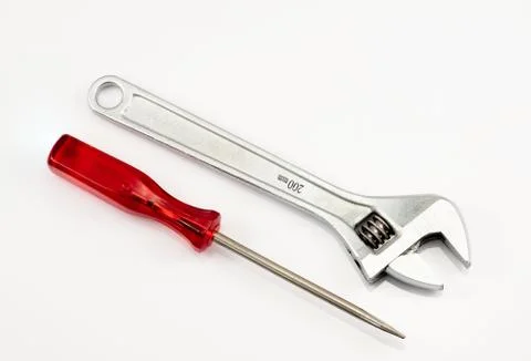 Spanner and a screwdriver on the white background Foto stock