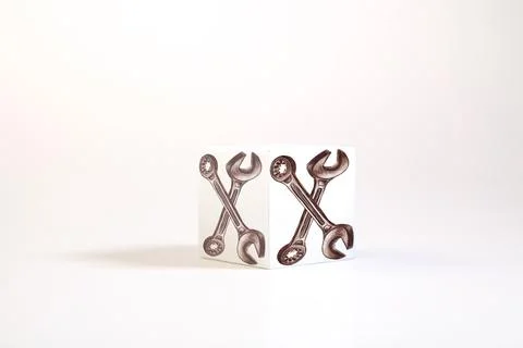 Spanner and wrench on a white background, close-up Stock Photos